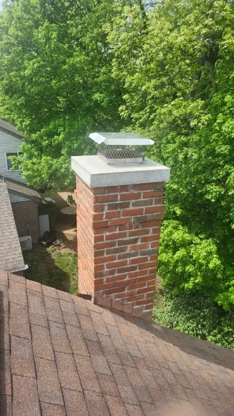 Repaired brick chimney with a new concrete crown and cap in Greater Cincinnati, OH